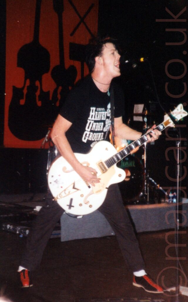 Chris Cheny, singer and guitarist with Australian Psychobilly Punk band The Living End, on stage at Academy 2, Manchester, 31st March 2001.